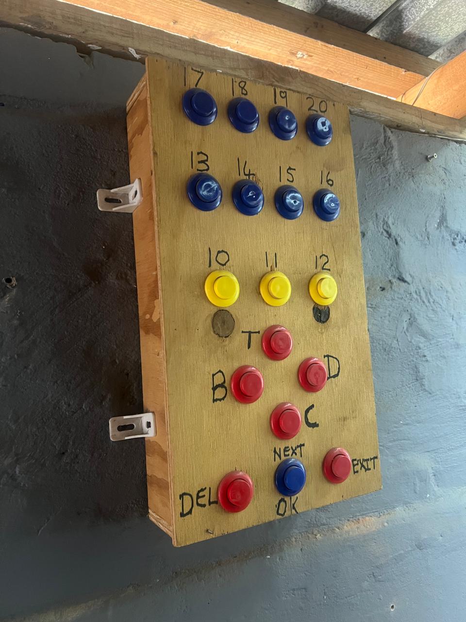 The first wooden DartArcade prototype with arcade buttons mounted on a rough box